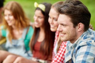 group of smiling friends outdoors