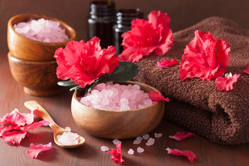 Obraz na płótnie Canvas spa aromatherapy with azalea flowers and herbal salt on rustic d