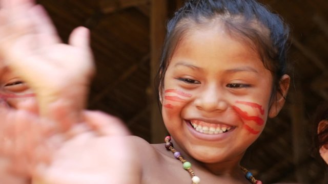 Cute native Brazilians having fun at an indigenous tribe in the Amazon