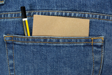 pencil and note paper in a blue jean pocket