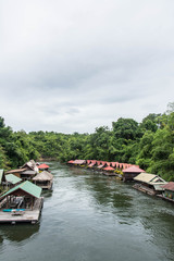 Obraz premium floating house in river Kwai. Taken at Sai Yok Yai waterfall. Kanchanaburi of Thailand.