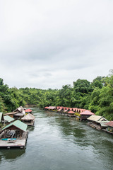 Obraz premium floating house in river Kwai. Taken at Sai Yok Yai waterfall. Kanchanaburi of Thailand.