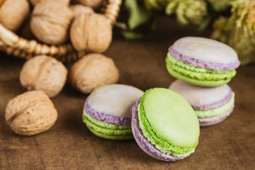 Green and purple macaroons. Rustic scene