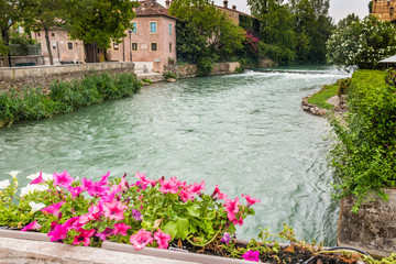 Fototapeta premium Waters and ancient buildings of Italian medieval village