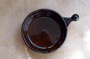 Brown saucer in the background tiles