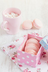 Pink macaroons in gift box. Pastel colored