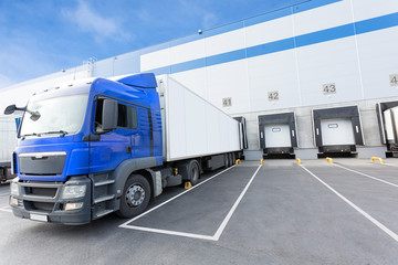 Blue Truck and Gates of Big distribution warehouse © hacohob