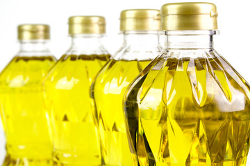 three bottles oil of refined palm olein from pericarp