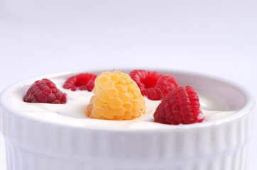 Natural yogurt with fresh raspberries