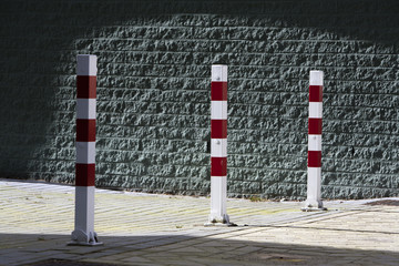 Red and white striped poles