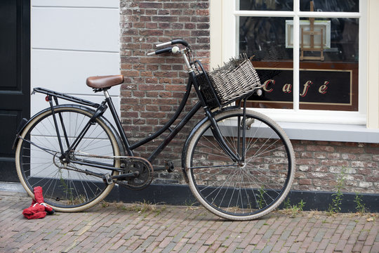 Old traditional bike parked in front of the café