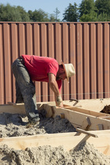 male construction worker working on the construction of the foun