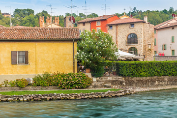 Fototapeta na wymiar Waters and ancient buildings of Italian medieval village