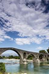 Fototapeta premium The Bridge of Arta is an old stone bridge that crosses the Arach
