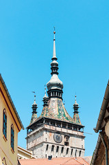 Obraz premium View of the clock tower in the medieval centre of Sighisoara, Romania