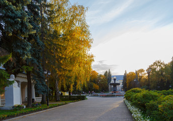 setting sun in a park with fountain