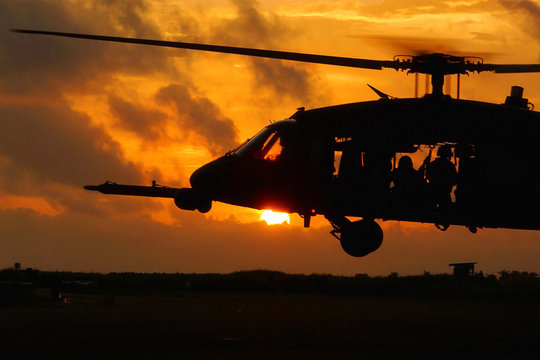 Helicopter soldiers at sunset