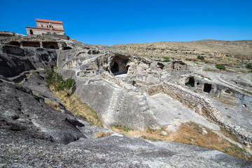 Fototapeta premium Christian Basilica in ancient rock-hewn town called Uplistsikhe in Georgia