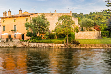 Fototapeta premium Waters and ancient buildings of Italian medieval village