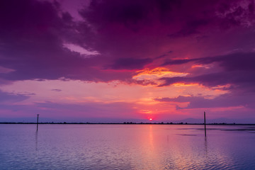 Beautiful sunset with clouds in the sky over ocean