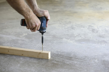 Close-up of Man Using Power Drill