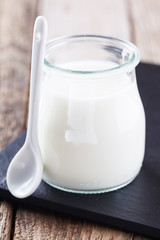 Obraz na płótnie Canvas Homemade yoghurt in a glass jar.selective focus