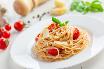 Pasta with tomato sauce, parmesan cheese and basil, Italian food