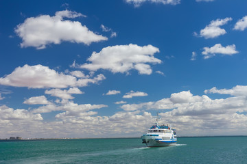 Pleasure boat is mooring to  small pier on a Black Sea