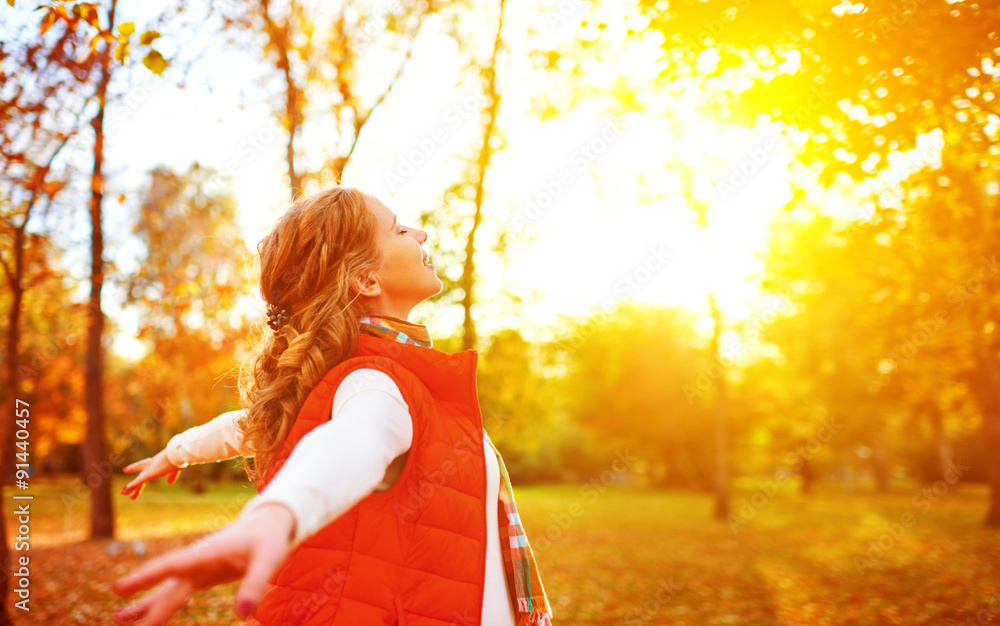 Wall mural happy girl enjoying life and freedom in the autumn on nature