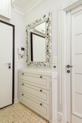 Shoe cabinet and mirror in the entryway