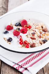  Granola, muesli , honey, yogurt and fresh berries .Healthy breakfast.selective focus