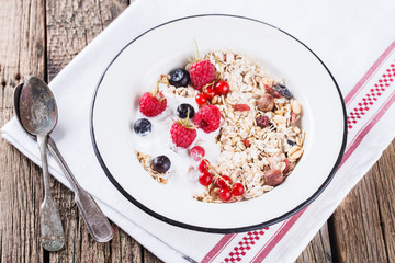  Granola, muesli , honey, yogurt and fresh berries .Healthy breakfast.selective focus