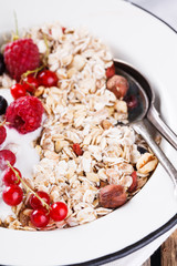  Granola, muesli , honey, yogurt and fresh berries .Healthy breakfast.selective focus
