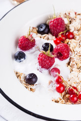  Granola, muesli , honey, yogurt and fresh berries .Healthy breakfast.selective focus