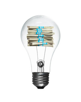 Lightbulb with a stack of money