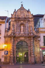 Cordoba - The portals of St. Paul church at dusk from year 1706 by Bartolome de Royas and Andres Pino Asciano.