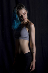 Fototapeta na wymiar Blue haired girl pose in studio