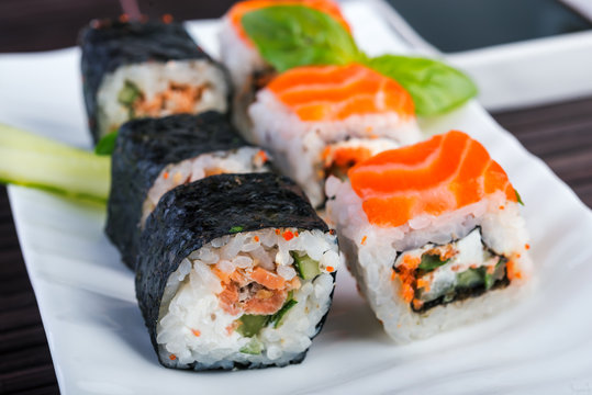 Salmon rolls on white dish. japanese food style.