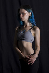 Blue haired girl pose in studio