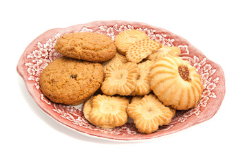 some different cookies on a dish