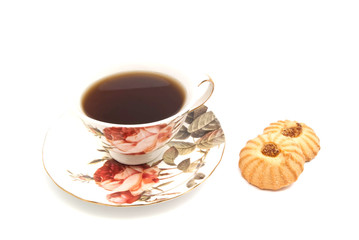 cup of tea and two cookies on white