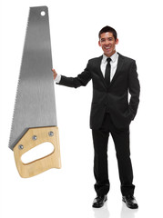Businessman holding a giant saw to the side, business tool conce
