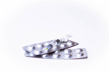 Medicine pills or capsules with syringe