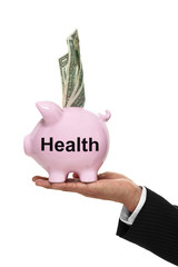Hand holding piggy bank for health savings with money in it