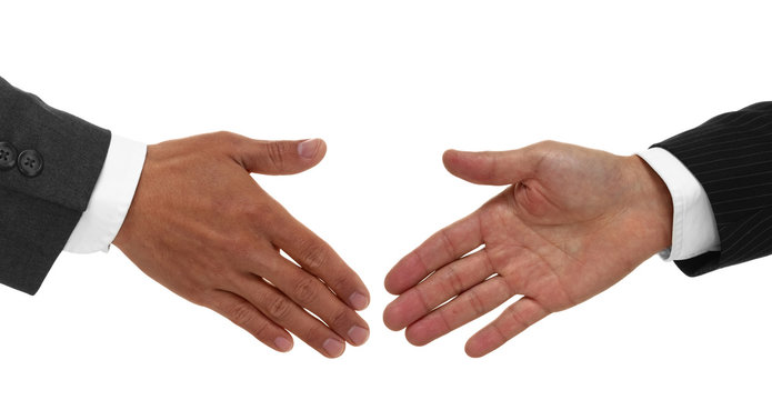 Two hands shaking in agreement isolated on white