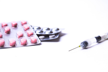 Medicine pills or capsules with syringe