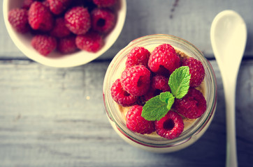 Healthy breakfast - fresh Greek yogurt with raspberries and mint