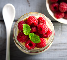 Healthy breakfast - fresh Greek yogurt with raspberries and mint