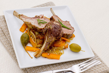 Grilled racks of lamb olive, capers and carrot