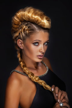 Portrait of blonde lady in creative hair.
